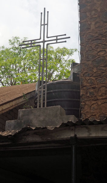 Metal cross on building