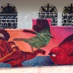 Bright mural with birds and woman.