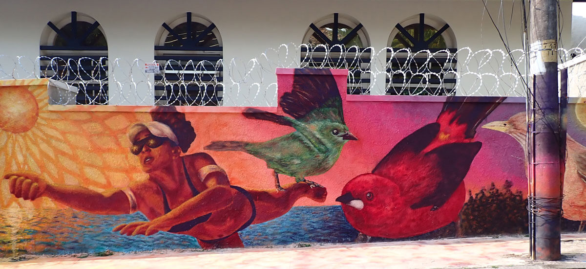 Bright mural with birds and woman.